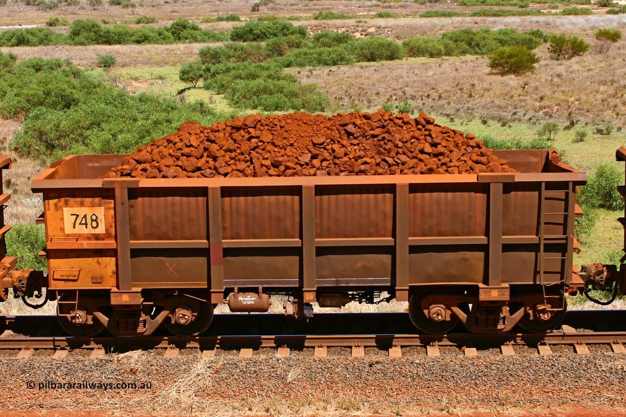 0748 061209 8189
Robe River ore waggon 748, built by Tomlinson Steel WA, non-handbrake side loaded view at the 7 km location just south of Cape Lambert yard. December 9, 2006.
Keywords: 748;Tomlinson-Steel-WA;Robe-ore-waggon;