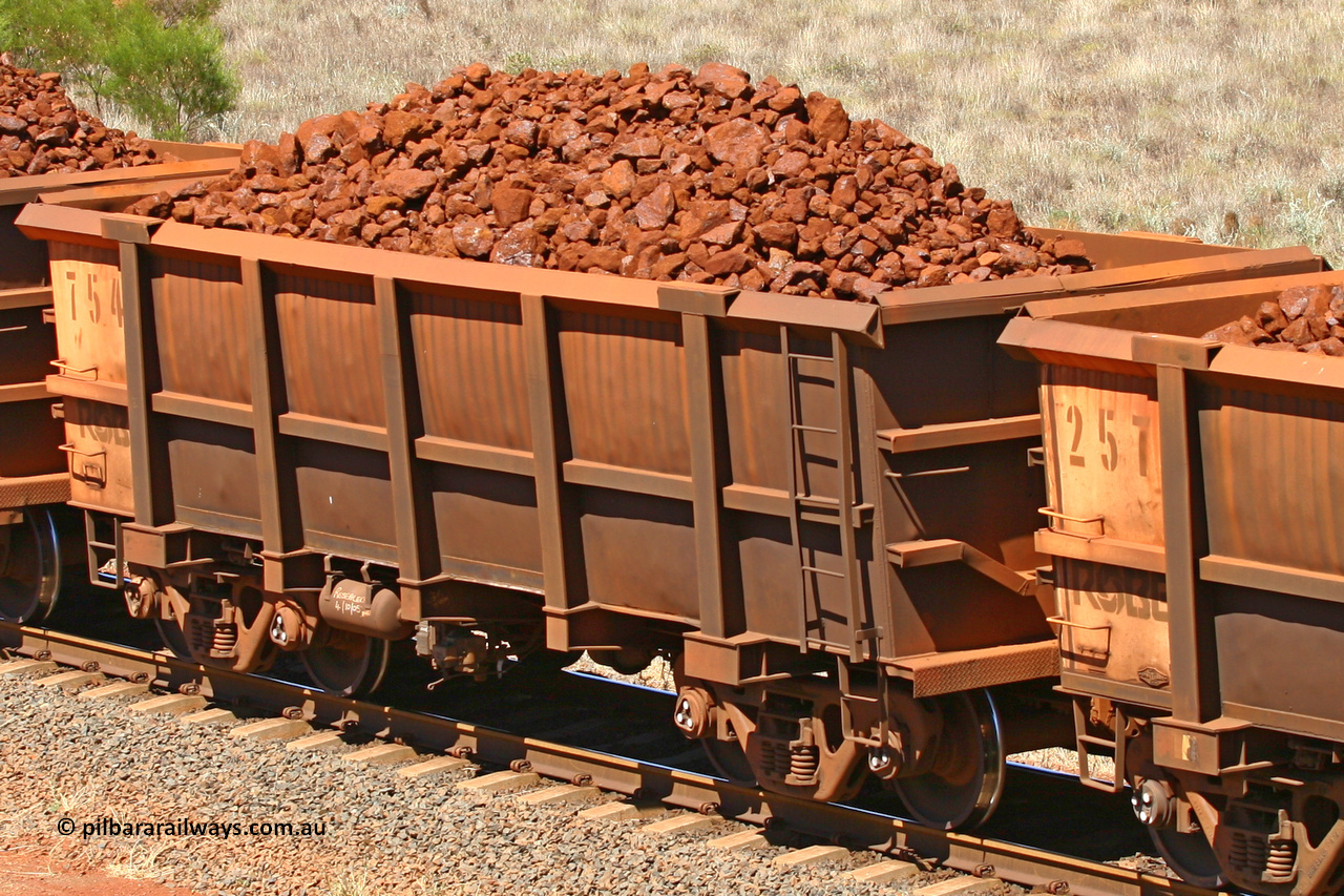 0754 061209 8179
Robe River ore waggon 754, built by Centurion Industries WA, fixed coupler non-handbrake side loaded view at the 7 km location just south of Cape Lambert yard. December 9, 2006.
Keywords: 754;Centurion-Industries-WA;Robe-ore-waggon;
