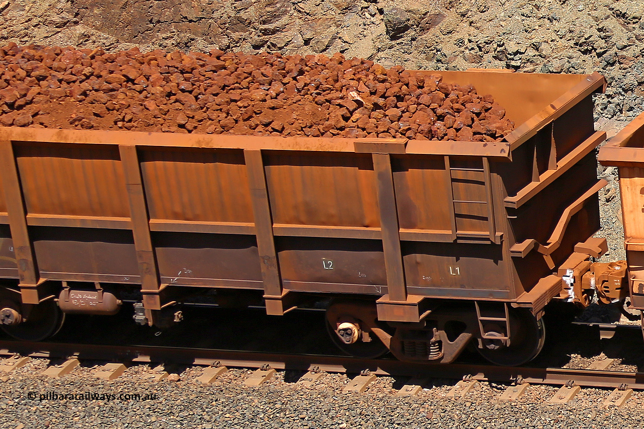 0762 160306 1659
Robe River ore waggon 762, built by Centurion Industries WA, fixed coupler non-handbrake side loaded partial view showing drop rib end, at the 45 km, Harding Siding on the Cape Lambert line. March 6, 2016.
Keywords: 762;Centurion-Industries-WA;Robe-ore-waggon;