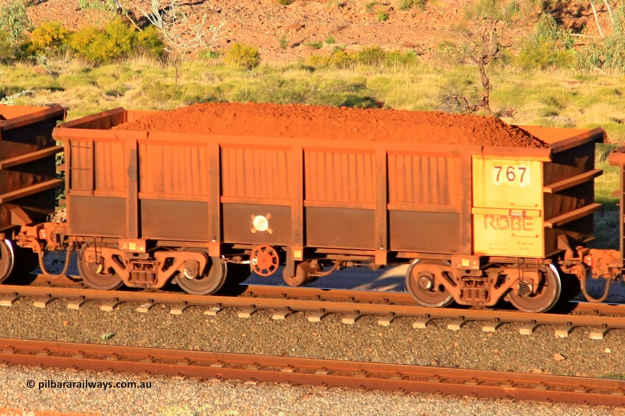 0767 110602 1644
Robe River ore waggon 767, built by Centurion Industries WA, rotary coupler end handbrake side loaded view at the 71 km, Western Creek on the Deepdale line. June 2, 2011.
Keywords: 767;Centurion-Industries-WA;Robe-ore-waggon;