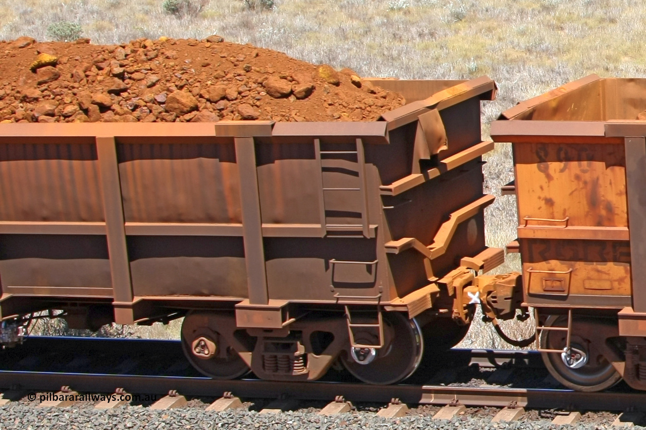 0771 081209 0169
Robe River ore waggon 771, built by Centurion Industries WA, fixed coupler non-handbrake side loaded view showing drop rib end at the 7 km location just south of Cape Lambert yard. December 9, 2008.
Keywords: 771;Centurion-Industries-WA;Robe-ore-waggon;