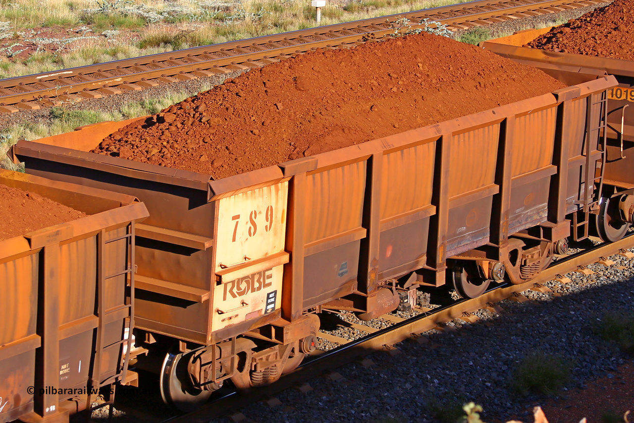 0789 210322 9795
Robe River ore waggon 789, built by Centurion Industries  WA, rotary coupler end non-handbrake side loaded view at the 17 km on the Cape Lambert line, March 22, 2021.
Keywords: 789;Centurion-Industries-WA;Robe-ore-waggon;