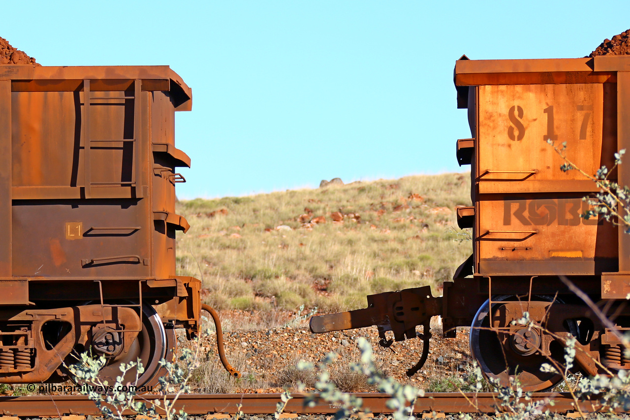 0817 180616 1676
Robe River ore waggon 817, built by Centurion Industries WA, rotary coupler end non-handbrake side loaded view with the pulled fixed coupler from 425 at the 33.7 km, Arches on the Cape Lambert line, June 16, 2018.
Keywords: 817;Centurion-Industries-WA;Robe-ore-waggon;