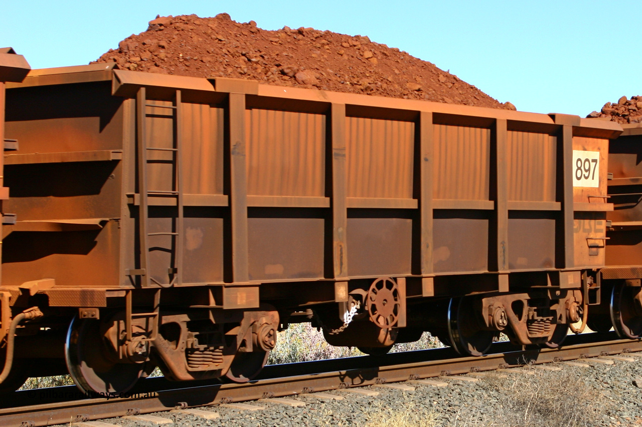0897 060716 7187
Robe River ore waggon 897, built by Centurion Industries WA, fixed coupler end handbrake side loaded view at the 71 km on the Deepdale line, Western Creek, July 16, 2006.
Keywords: 897;Centurion-Industries-WA;Robe-ore-waggon;