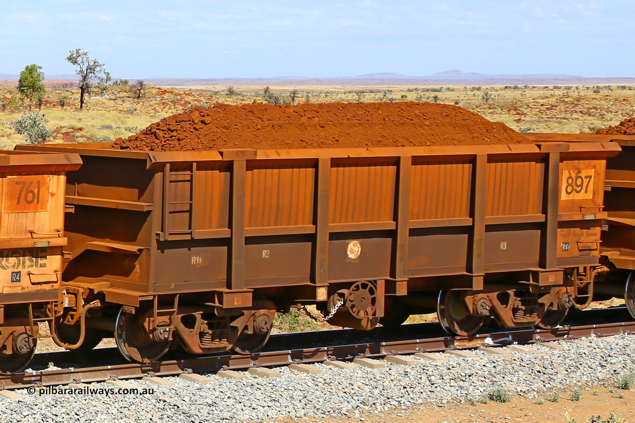 0897 170729 0254
Robe River ore waggon 897, built by Centurion Industries WA, fixed coupler handbrake side loaded view at the 103 km, between Maitland Siding and the Fortescue River on the Deepdale line. July 29, 2017.
Keywords: 897;Centurion-Industries-WA;Robe-ore-waggon;