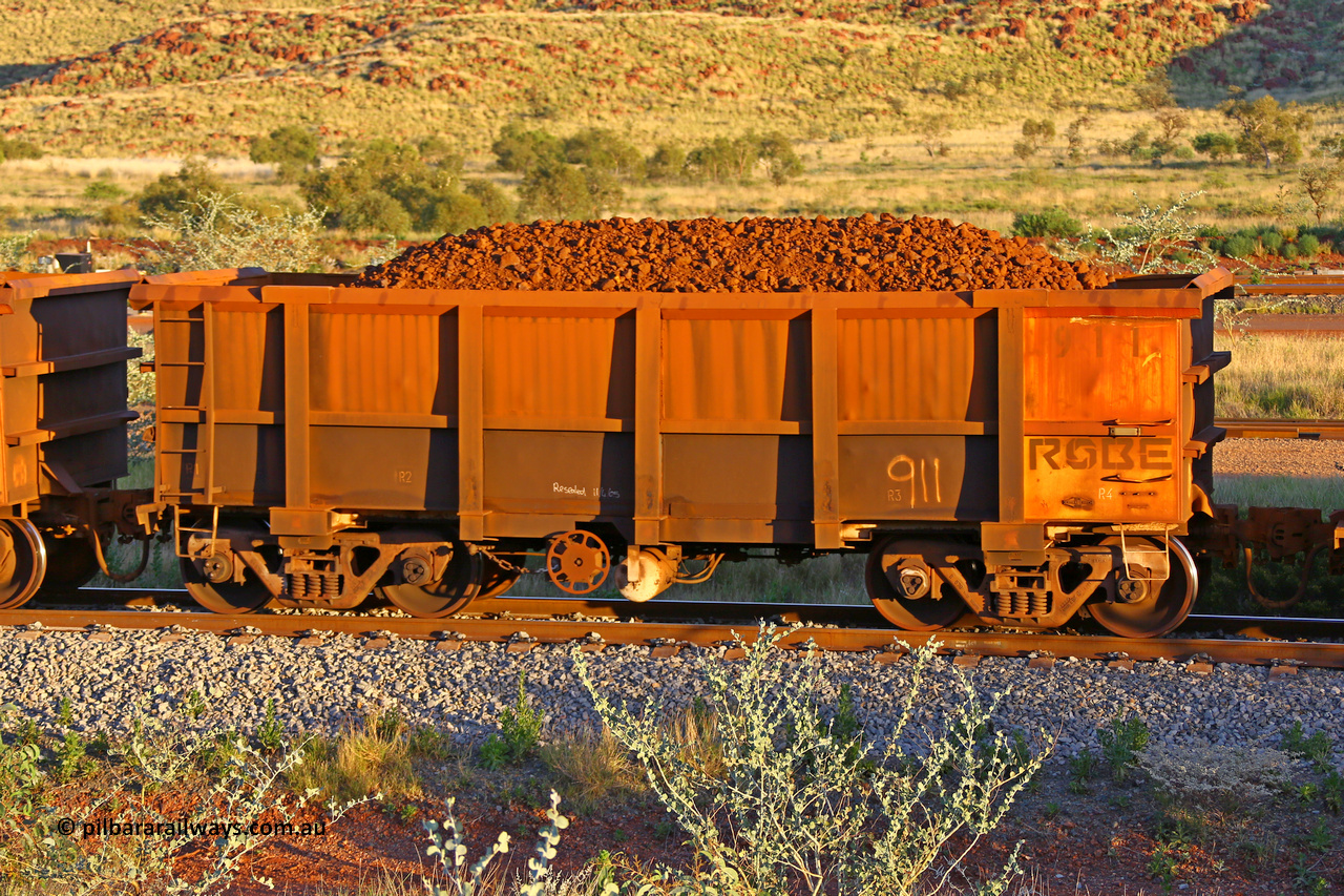0911 170513 8679
Robe River ore waggon 911, built by Nippon Sharyo Nihon, rotary coupler end handbrake side loaded view, note modified underfloor arrangement, Cape Lambert yard, May 13, 2017.
Keywords: 911;Nippon-Sharyo-Nihon-Japan;Robe-ore-waggon;