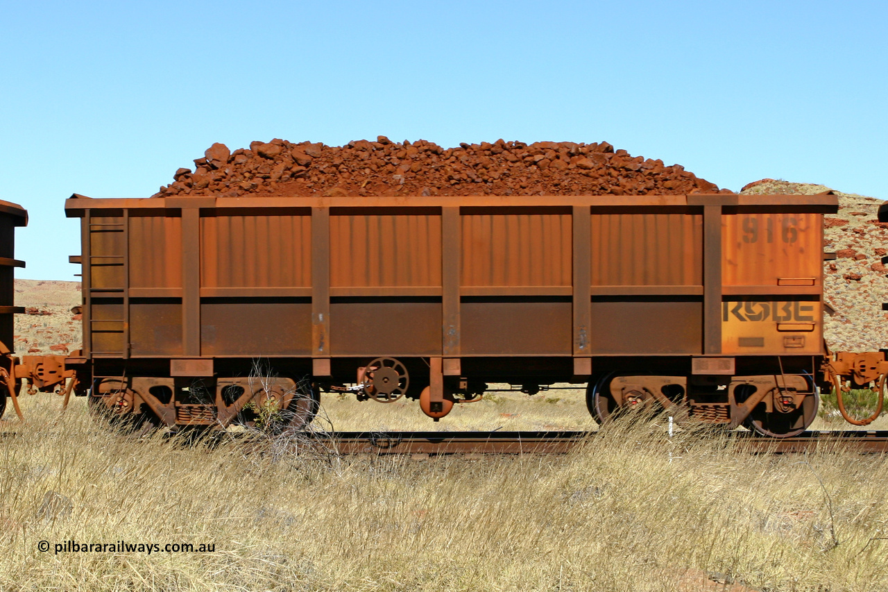 0916 060722 7527
Robe River ore waggon 916, built by Centurion Industries WA, handbrake side loaded view at the 78.8 km between Western Creek and Maitland on the Deepdale line. July 22, 2006.
Keywords: 916;Centurion-Industries-WA;Robe-ore-waggon;