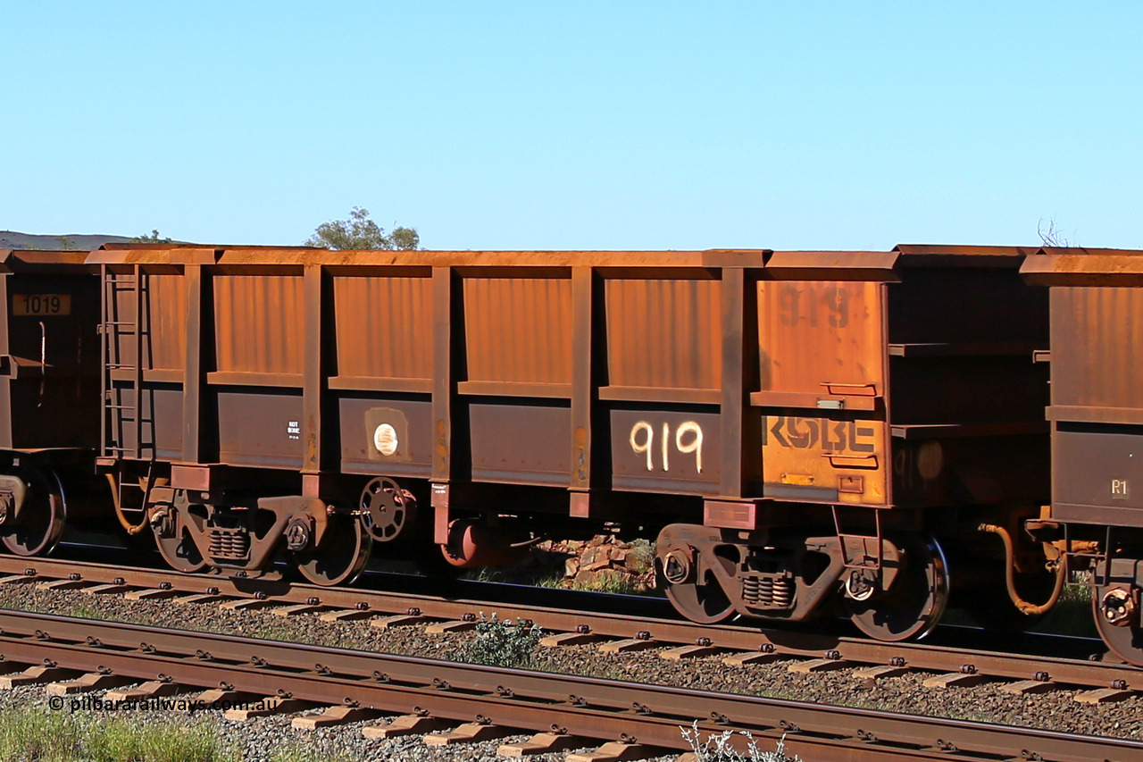 0919 160727 0950
Robe River ore waggon 919, built by Centurion Industries WA, rotary coupler end handbrake side empty view at Harding Siding on the Cape Lambert line, July 27, 2016.
Keywords: 919;Centurion-Industries-WA;Robe-ore-waggon;