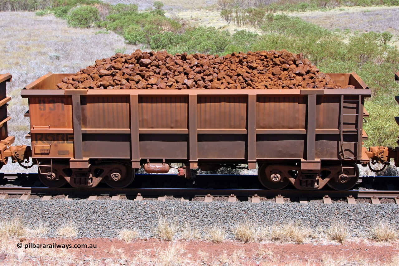 0931 081209 0119
Robe River ore waggon 931, built by Centurion Industries WA, non-handbrake side loaded view at the 7 km location just south of Cape Lambert yard. December 9, 2008.
Keywords: 931;Centurion-Industries-WA;Robe-ore-waggon;