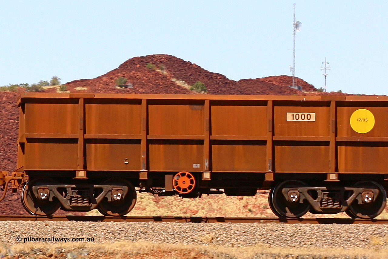 1000 060722 7436
Robe River ore waggon 1000, class leader built by Bradken Rail Qld in December 2005, fixed coupler handbrake side empty, partial, view at the 45.4 km just south of Harding Siding on the Cape Lambert line. July 22, 2006.
Keywords: 1000;Bradken-Rail-Qld;Robe-ore-waggon;