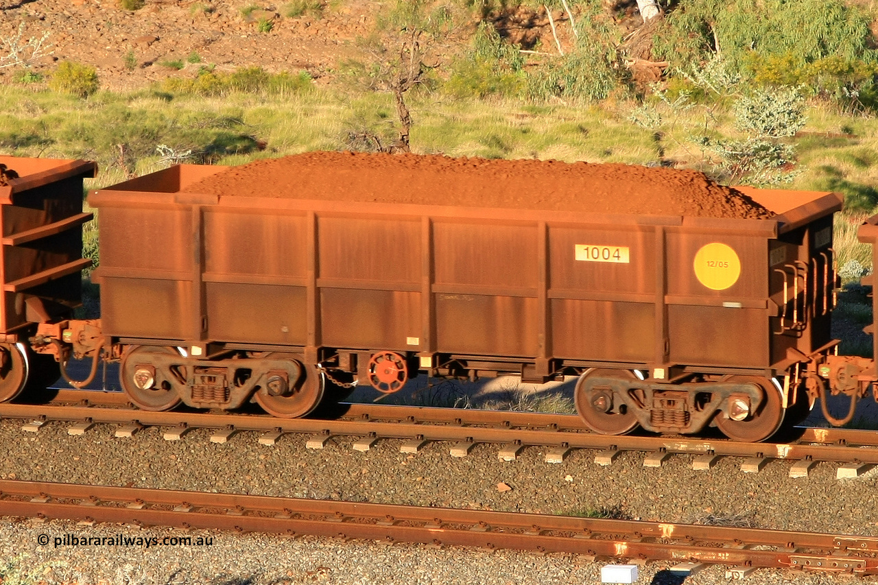 1004 110602 1609
Robe River ore waggon 1004, built by Bradken Rail Qld in December 2005, rotary coupler end handbrake side loaded view at the 71 km, Western Creek on the Deepdale line. June 2, 2011.
Keywords: 1004;Bradken-Rail-Qld;Robe-ore-waggon;