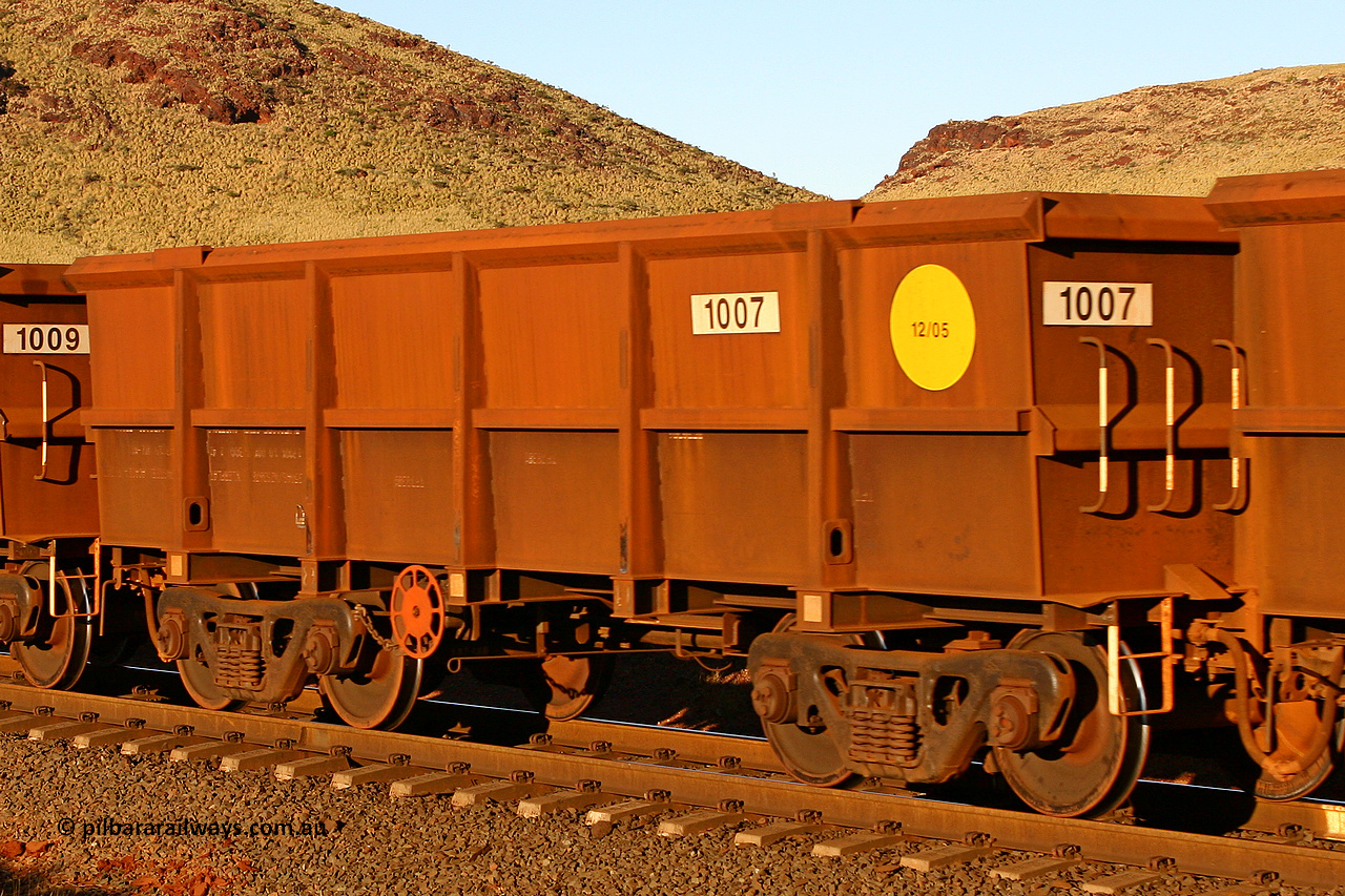 1007 060722 7599
Robe River ore waggon 1007, built by Bradken Rail Qld in December 2005, rotary coupler end handbrake side empty view, at the 11.7 km, Cape Lambert. July 22, 2006.
Keywords: 1007;Bradken-Rail-Qld;Robe-ore-waggon;