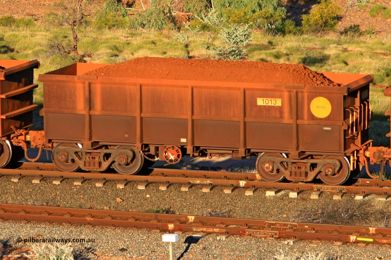 1013 110602 1633
Robe River ore waggon 1013, built by Bradken Rail Qld in December 2005, rotary coupler end handbrake side loaded view at the 71 km, Western Creek on the Deepdale line. June 2, 2011.
Keywords: 1013;Bradken-Rail-Qld;Robe-ore-waggon;