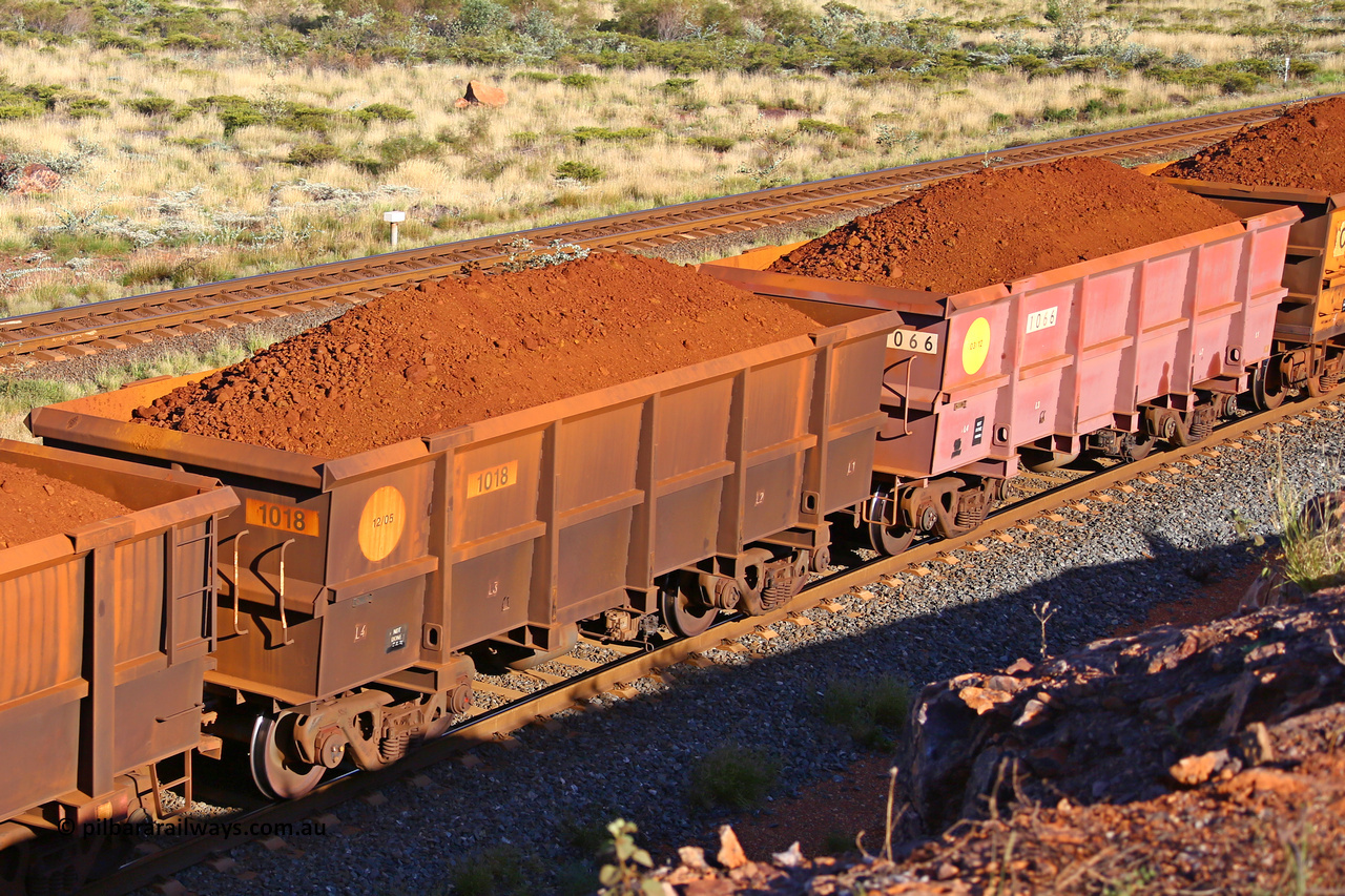 1018-1066 210322 9792
Robe River ore waggon 1018, built by Bradken Rail Qld in December 2005, rotary coupler end non-handbrake side loaded view comparion between painted and unpainted Bradken builds, at the 17 km on the Cape Lambert line, March 22, 2021.
Keywords: 1018;Bradken-Rail-Qld;Robe-ore-waggon;