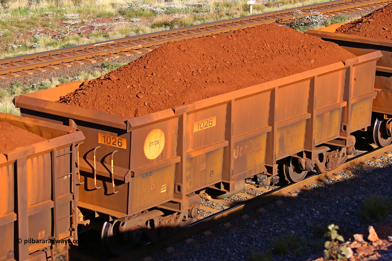 1026 210322 9715
Robe River ore waggon 1026, built by Bradken Rail Qld in January 2006, rotary coupler end non-handbrake side loaded view, at the 17 km on the Cape Lambert line, March 22, 2021.
Keywords: 1026;Bradken-Rail-Qld;Robe-ore-waggon;