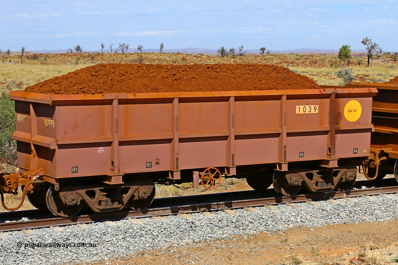 1039 170729 0210
Robe River ore waggon 1039, built by Bradken Rail Qld in April 2012, fixed coupler handbrake side loaded view at the 103 km, between Maitland Siding and the Fortescue River on the Deepdale line. July 29, 2017.
Keywords: 1039;Bradken-Rail-Qld;Robe-ore-waggon;