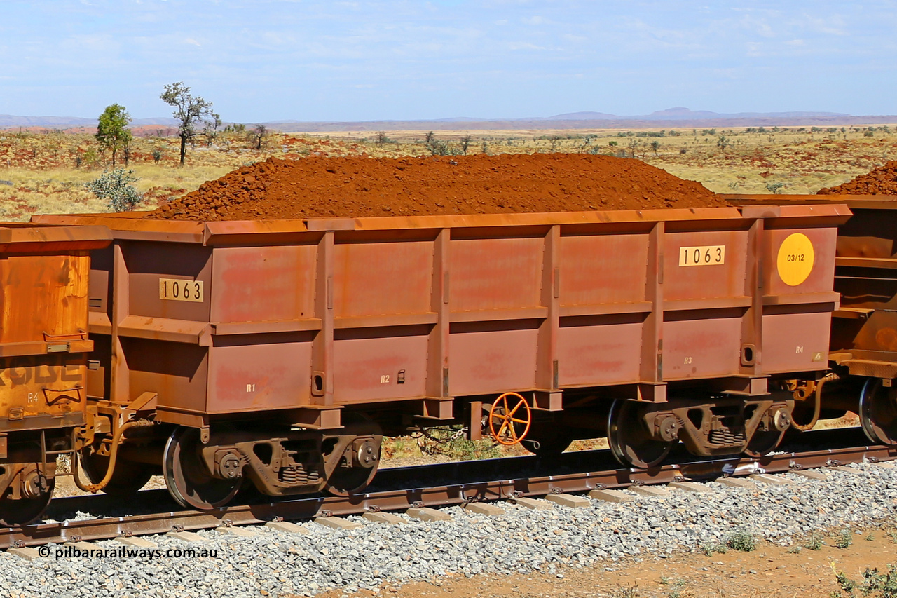 1063 170729 0265
Robe River ore waggon 1063, built by Bradken Rail Qld in March 2012, fixed coupler handbrake side loaded view at the 103 km, between Maitland Siding and the Fortescue River on the Deepdale line. July 29, 2017.
Keywords: 1063;Bradken-Rail-Qld;Robe-ore-waggon;