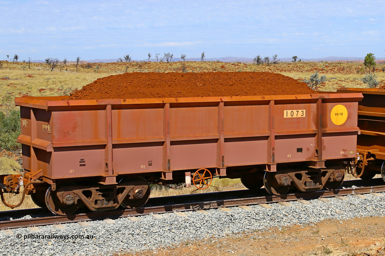 1073 170729 0251
Robe River ore waggon 1073, built by Bradken Rail Qld in April 2012, fixed coupler handbrake side loaded view at the 103 km, between Maitland Siding and the Fortescue River on the Deepdale line. July 29, 2017.
Keywords: 1073;Bradken-Rail-Qld;Robe-ore-waggon;