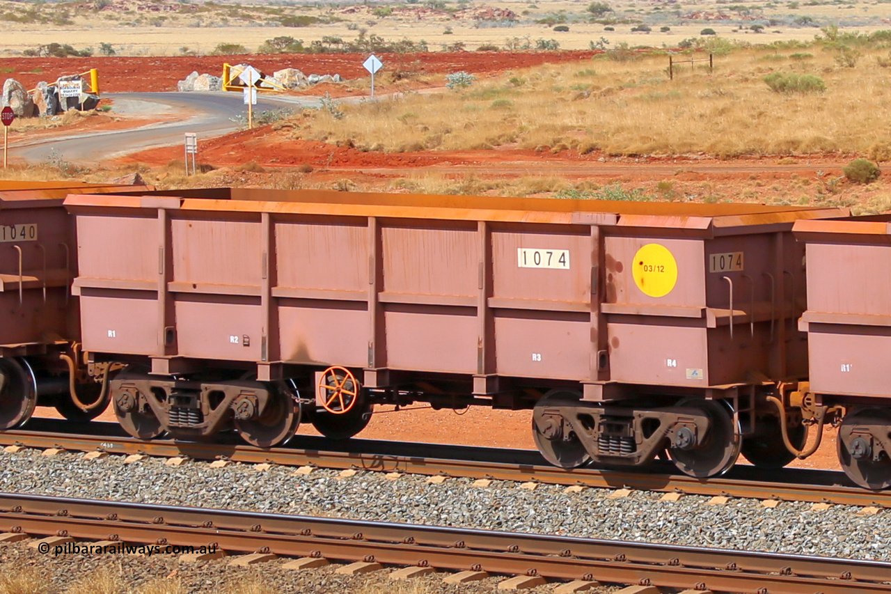 1074 141124 6811
Robe River ore waggon 1074, built by Bradken Rail Qld in March 2012, rotary coupler end handbrake side empty view at the 25 km at Arches Siding on the Cape Lambert line. November 24, 2014.
Keywords: 1074;Bradken-Rail-Qld;Robe-ore-waggon;