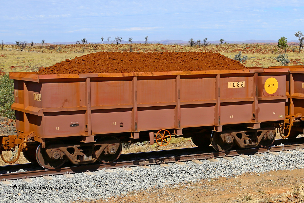 1086 170729 0215
Robe River ore waggon 1086, built by Bradken Rail Qld in May 2012, fixed coupler handbrake side loaded view at the 103 km, between Maitland Siding and the Fortescue River on the Deepdale line. July 29, 2017.
Keywords: 1086;Bradken-Rail-Qld;Robe-ore-waggon;