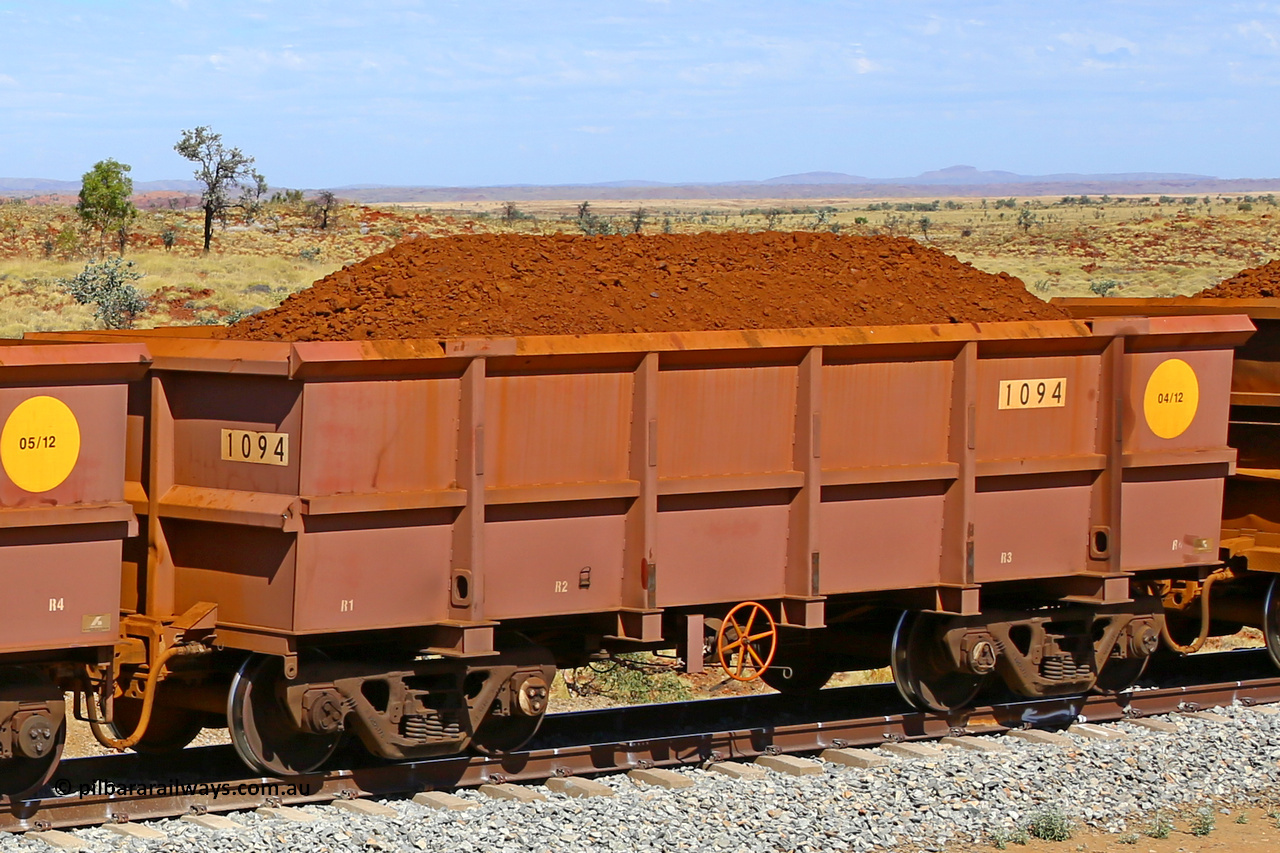 1094 170729 0215
Robe River ore waggon 1094, built by Bradken Rail Qld in April 2012, fixed coupler handbrake side loaded view at the 103 km, between Maitland Siding and the Fortescue River on the Deepdale line. July 29, 2017.
Keywords: 1094;Bradken-Rail-Qld;Robe-ore-waggon;