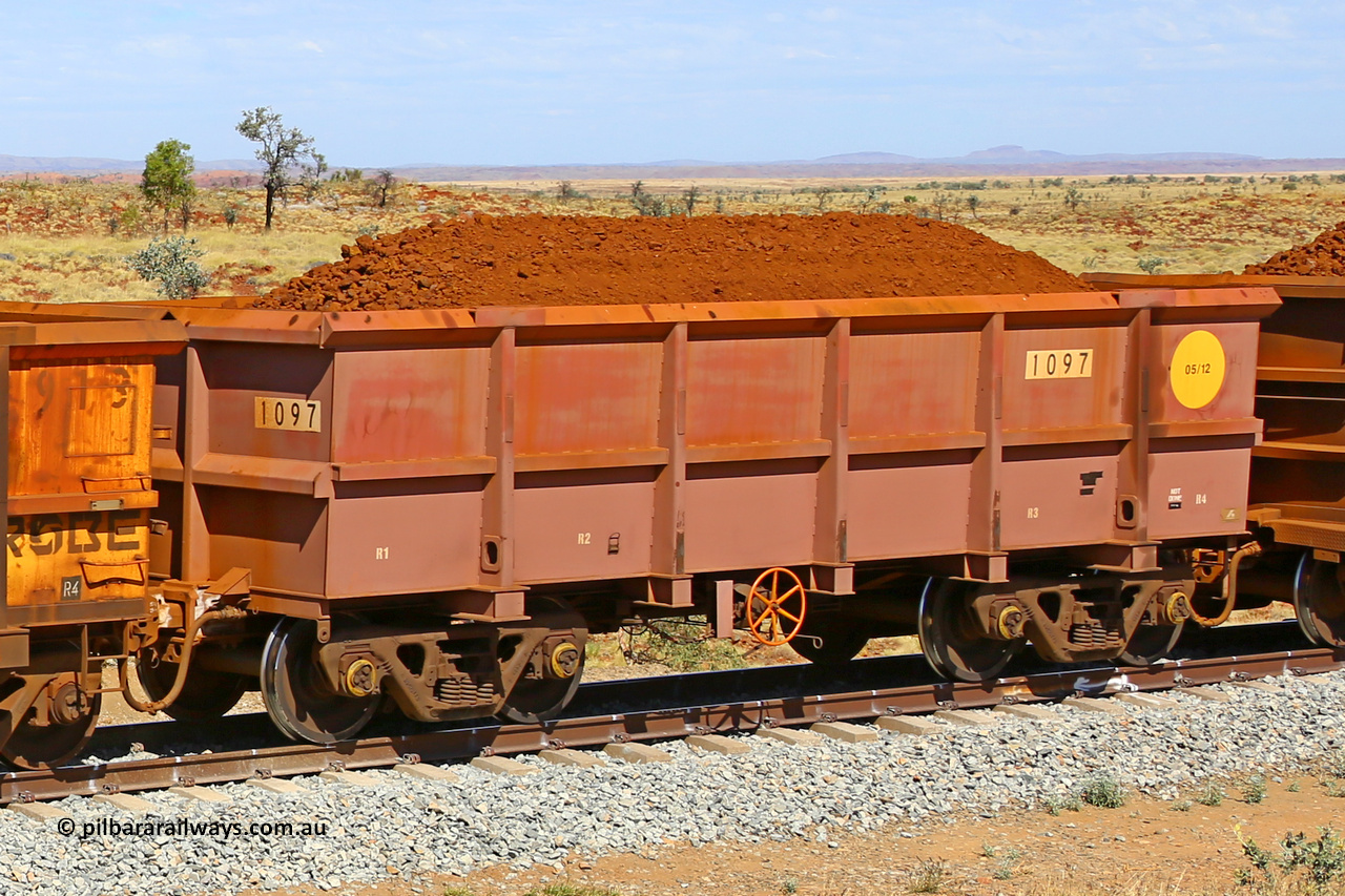 1097 170729 0255
Robe River ore waggon 1097, built by Bradken Rail Qld in May 2012, fixed coupler handbrake side loaded view at the 103 km, between Maitland Siding and the Fortescue River on the Deepdale line. July 29, 2017.
Keywords: 1097;Bradken-Rail-Qld;Robe-ore-waggon;
