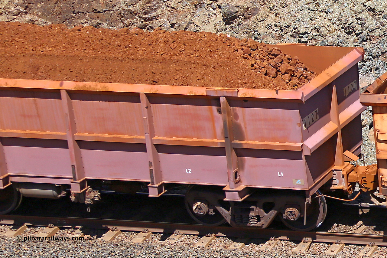 1127 160306 1631
Robe River ore waggon 1127, built by Bradken Rail Qld in March 2012, fixed coupler non-handbrake side loaded detail view of fixed end, at the 45 km, Harding Siding on the Cape Lambert line. March 6, 2016.
Keywords: 1127;Bradken-Rail-Qld;Robe-ore-waggon;