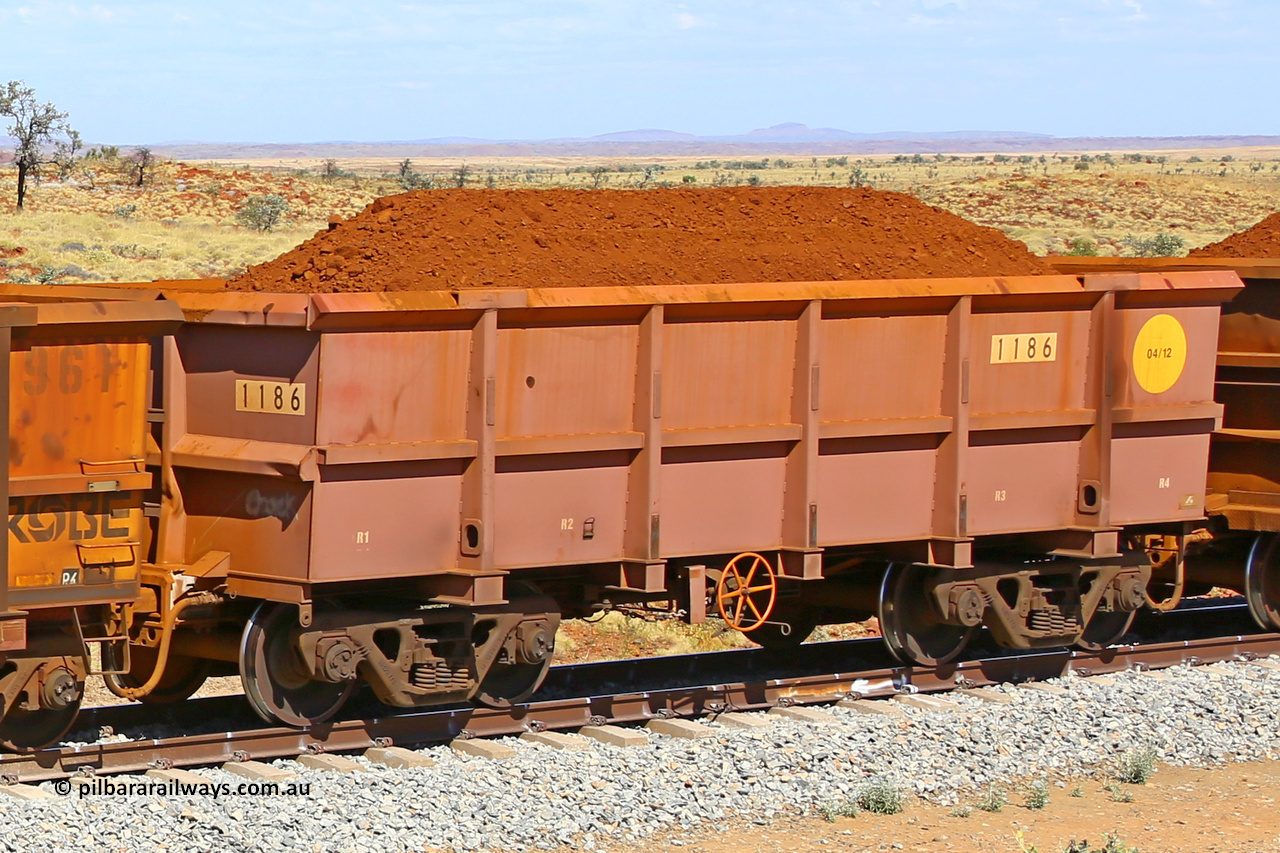 1186 170729 0217
Robe River ore waggon 1186, built by Bradken Rail Qld in April 2012, fixed coupler handbrake side loaded view at the 103 km, between Maitland Siding and the Fortescue River on the Deepdale line. July 29, 2017.
Keywords: 1186;Bradken-Rail-Qld;Robe-ore-waggon;