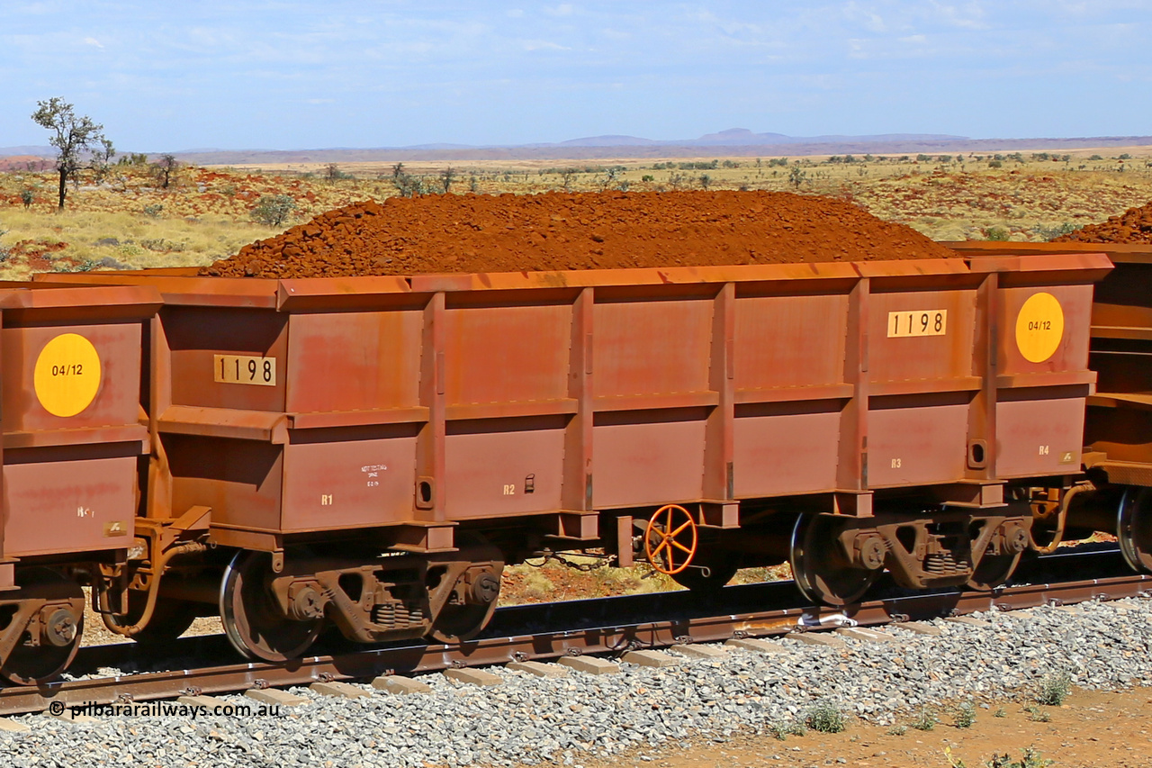 1198 170729 0258
Robe River ore waggon 1198, built by Bradken Rail Qld in April 2012, fixed coupler handbrake side loaded view at the 103 km, between Maitland Siding and the Fortescue River on the Deepdale line. July 29, 2017.
Keywords: 1198;Bradken-Rail-Qld;Robe-ore-waggon;