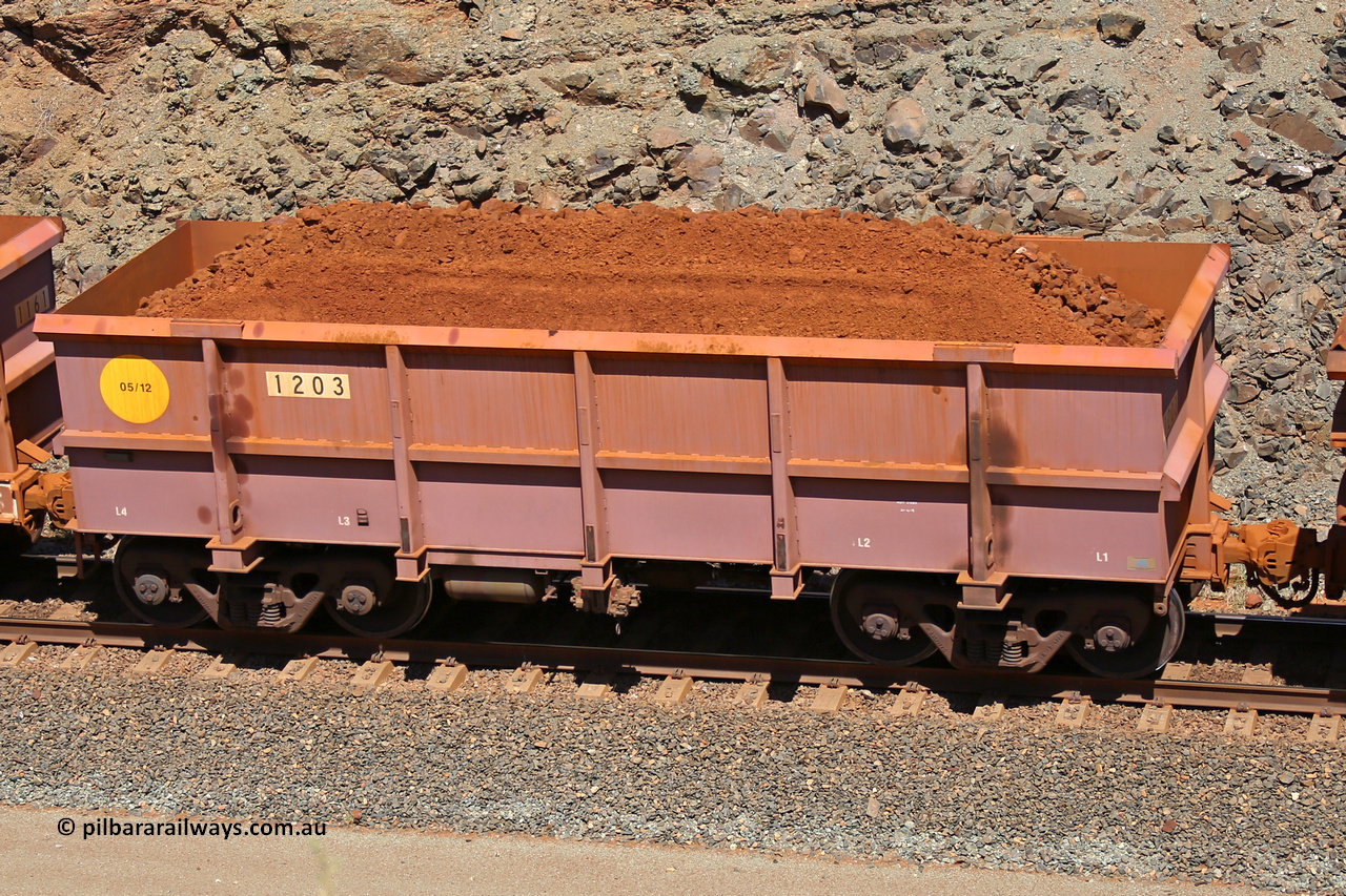 1203 160306 1624
Robe River ore waggon 1203, built by Bradken Rail Qld in May 2012, fixed coupler non-handbrake side loaded view, at the 45 km, Harding Siding on the Cape Lambert line. March 6, 2016.
Keywords: 1203;Bradken-Rail-Qld;Robe-ore-waggon;