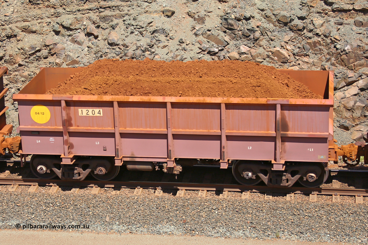 1204 160306 1560
Robe River ore waggon 1204, built by Bradken Rail Qld in April 2012, fixed coupler non-handbrake side loaded view, at the 45 km, Harding Siding on the Cape Lambert line. March 6, 2016.
Keywords: 1204;Bradken-Rail-Qld;Robe-ore-waggon;