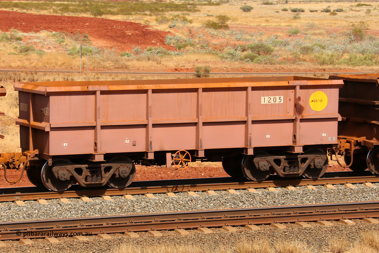 1205 141124 6826
Robe River ore waggon 1205, built by Bradken Rail Qld in May 2012, fixed coupler handbrake side empty view at the 25 km at Arches Siding on the Cape Lambert line. November 24, 2014.
Keywords: 1205;Bradken-Rail-Qld;Robe-ore-waggon;