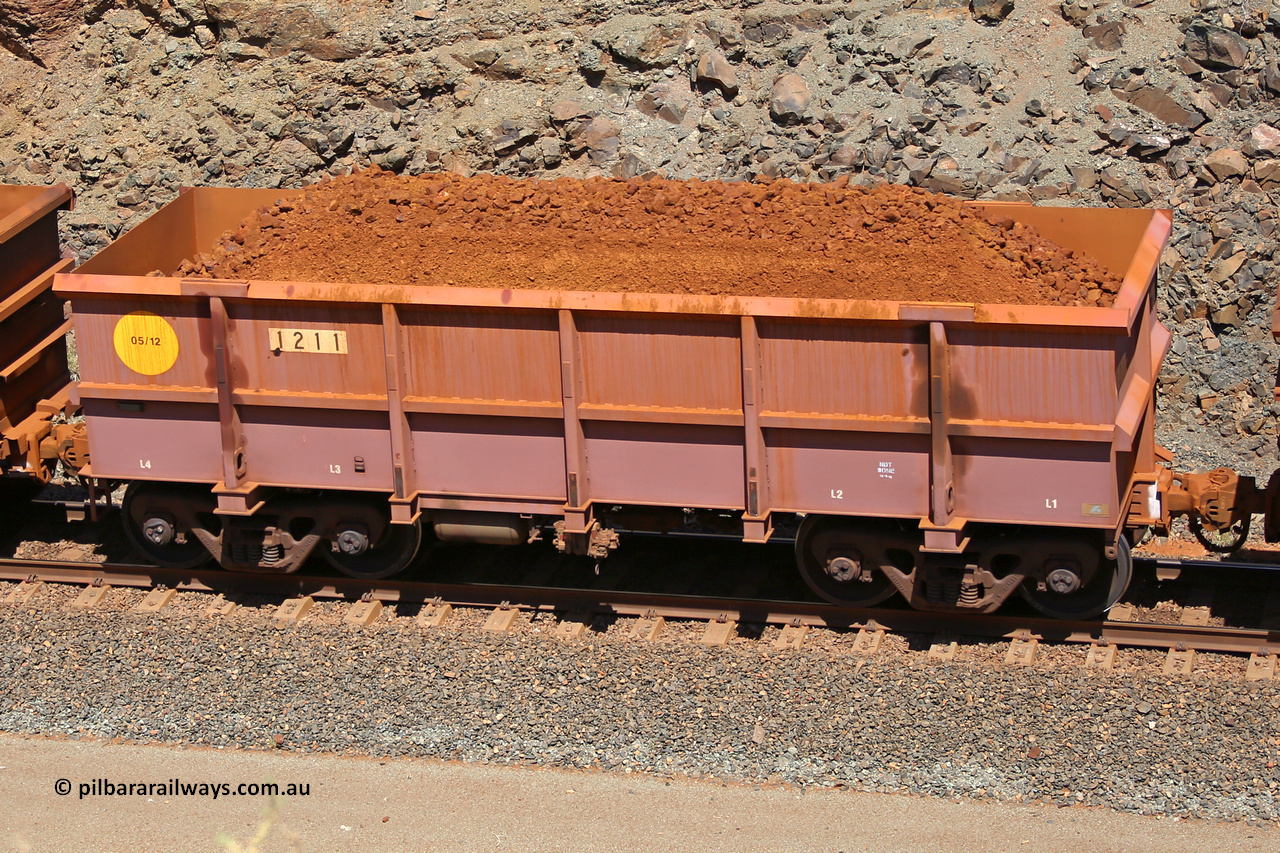 1211 160306 1644
Robe River ore waggon 1211, built by Bradken Rail Qld in May 2012, fixed coupler non-handbrake side loaded view, at the 45 km, Harding Siding on the Cape Lambert line. March 6, 2016.
Keywords: 1211;Bradken-Rail-Qld;Robe-ore-waggon;
