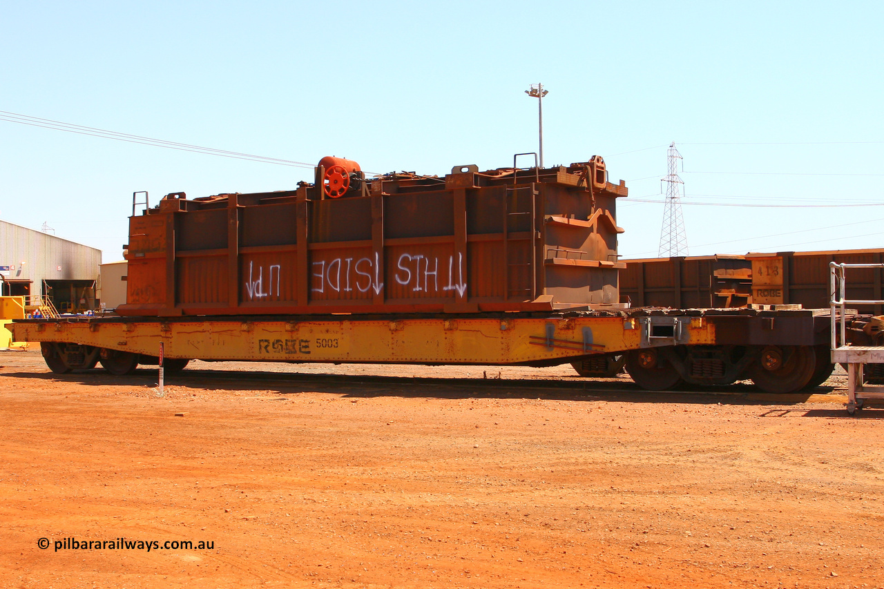 5003 070909 0669
Robe River flat waggon 5003 with recovered ore waggon, 765. At the Cape Lambert shops. September 9, 2007.
Keywords: 5003;Robe-flat-waggon;