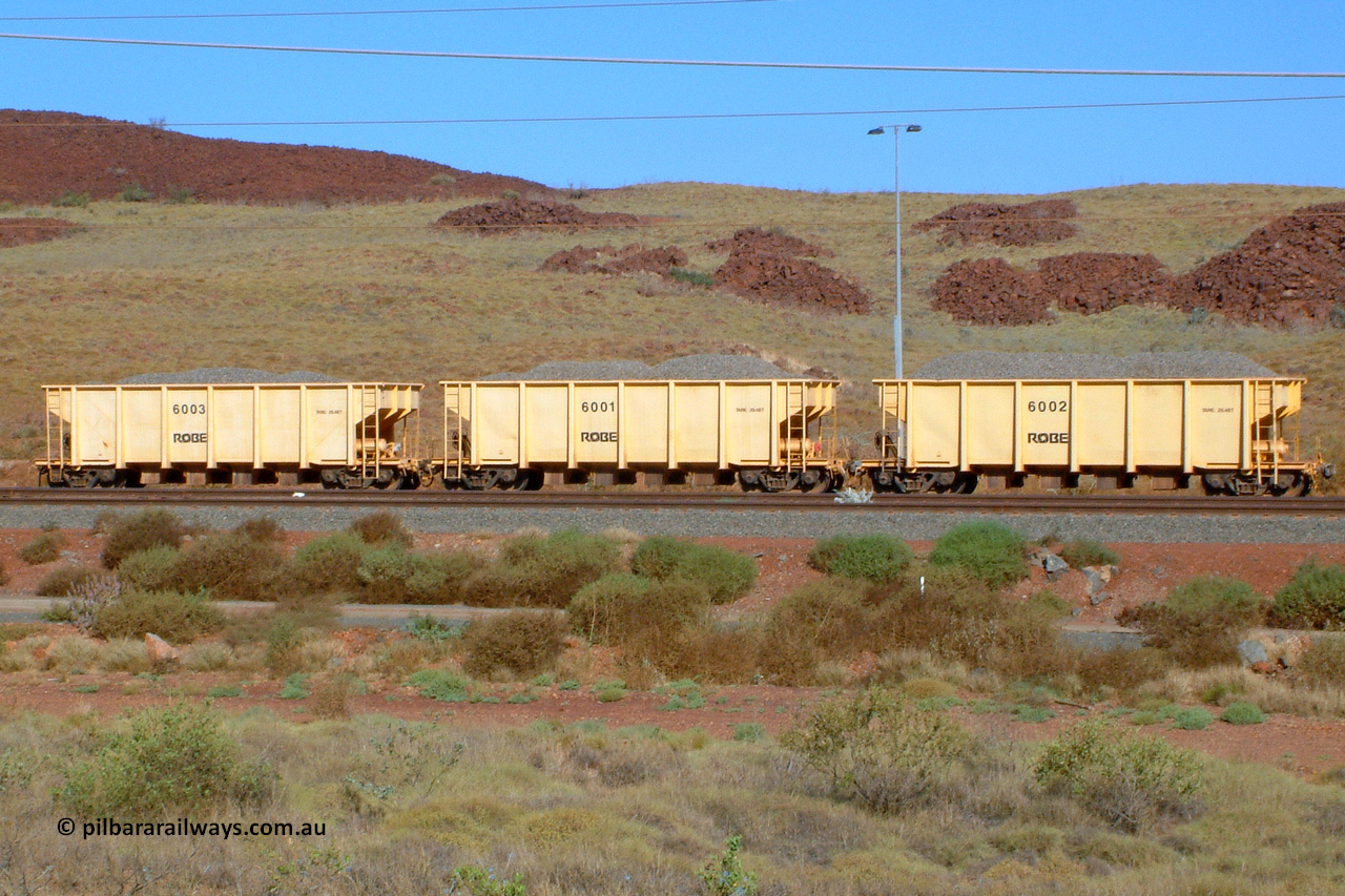 6001 041014 154934
Robe River ballast waggons. Robe had three built by Tomlinson Steel WA and numbered 6001 to 6003 as seen here in Cape Lambert yard. 1549 hours, October 14, 2004.
Keywords: 6001;Tomlinson-Steel-WA;Robe-ballast-waggon;