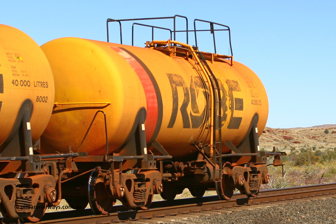 8001 060716 7201
Robe River diesel fuel tank waggon 8001 running empty on the rear of a loaded ore train, built by Comeng NSW in September 1972 with a 45,000 litre capacity, at the 71 km on the Deepdale line, Western Creek, July 16, 2006.
Keywords: 8001;Comeng-NSW;Robe-tank-waggon;
