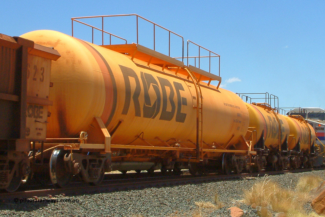 8003 050110 122348
Robe River diesel fuel tank waggon 8003 running loaded on an empty ore train at Maitland Siding [Sinding Two], built by Comeng NSW in March 1979 with a 100,000 litre capacity. 1223 hours, January 10, 2005.
Keywords: 8003;Comeng-NSW;Robe-tank-waggon;