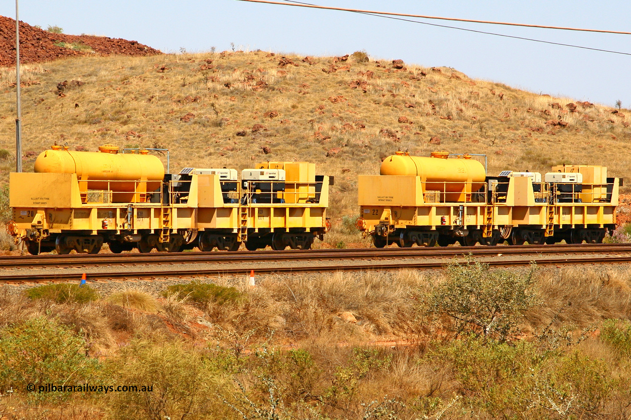 IC20 070908 0594
Robe River compressor waggon sets IC 20 with air receiver and IC 21 with two Ingersoll Rand air compressors and IC 22 with receiver and IC 23 with compressors. These waggons are ballasted to 100 tonnes each and are modified ore waggons and used on the pooled fleet rakes that come from HIY [Yandicoogina] and West Angelas mines. Cape Lambert yard, August 8 2007.
Keywords: IC20;IC21;IC22;IC23;robe-compressor-waggon;