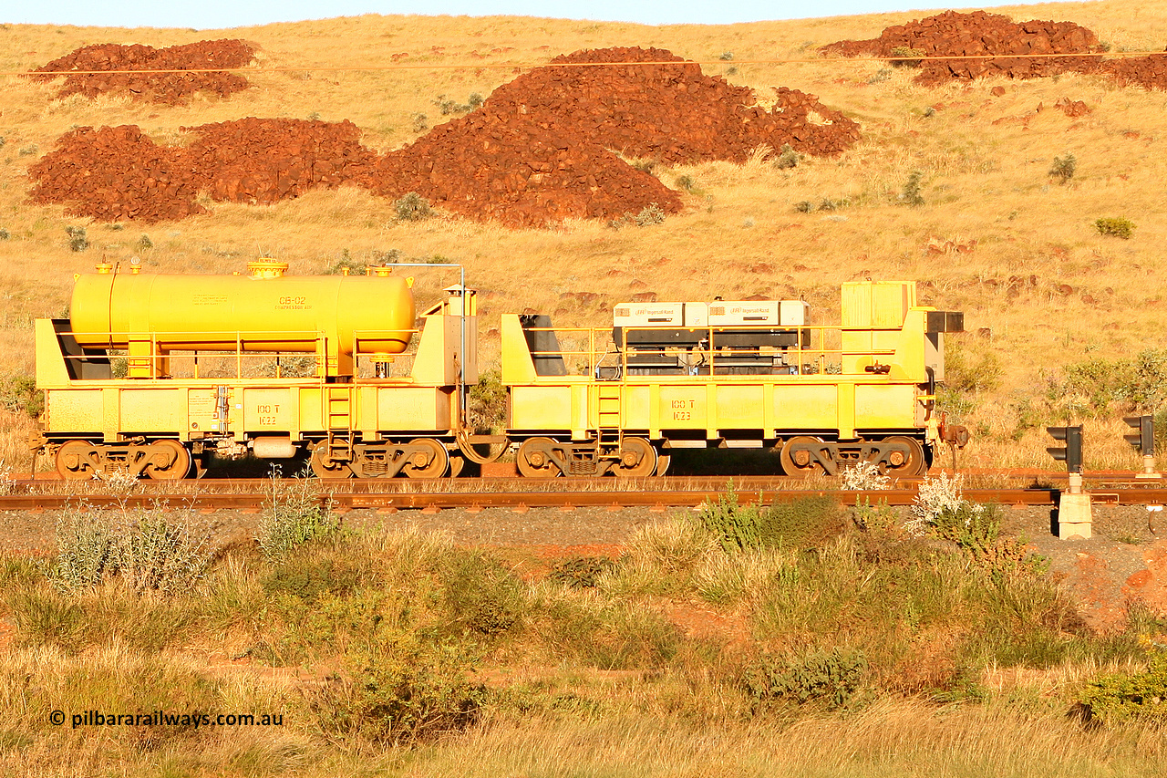 IC22 060722 7637
Robe River compressor waggon set IC 22 with air receiver and IC 23 with two Ingersoll Rand air compressors. These waggons are ballasted to 100 tonnes each and are modified ore waggons and used on the pooled fleet rakes that come from HIY [Yandicoogina] and West Angelas mines. Cape Lambert, July 22, 2006.
Keywords: IC22;robe-compressor-waggon;