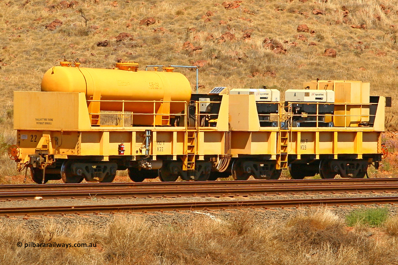 IC22 070908 0595
Robe River compressor waggon set IC 22 with air receiver and IC 23 with two Ingersoll Rand air compressors. These waggons are ballasted to 100 tonnes each and are modified ore waggons and used on the pooled fleet rakes that come from HIY [Yandicoogina] and West Angelas mines. Cape Lambert yard, August 8, 2007.
Keywords: IC22;IC23;robe-compressor-waggon;