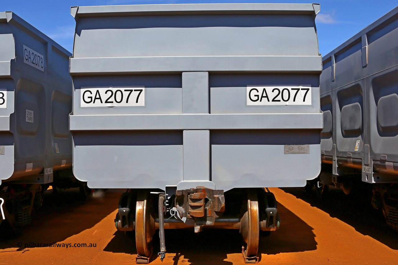 150314 7767
Wedgefield, following the delivery of Roy Hill's 1196 new GA type CCK138 model waggons, they were stored in several site whilst awaiting for enough track to be laid to allow delivery onto rail. GA2077 end view showing fixed end, only the even numbered waggons, or control waggon, has an uncoupling lever, the odd numbered, or slave waggons do not. March 14. 2015.
Keywords: GA-type;GA2077;CSR-Yangtze;CCK138