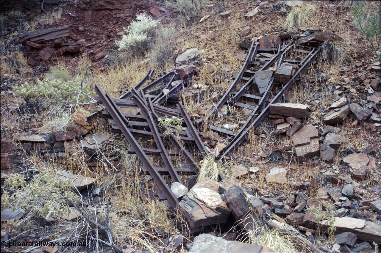 194-02
Wittenoom Gorge, Colonial Mine, asbestos mining remains, pile of railway points or switches, two left handed and one right handed.
