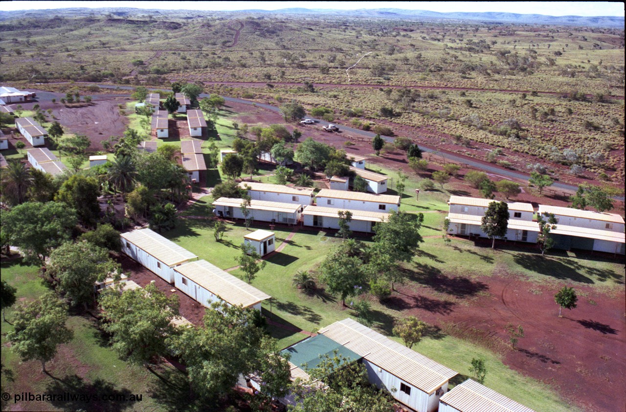 194-29
Yandi campsite for Henry Walker operated iron ore mine owned and managed by BHP, view of camp are from man cage on Kato 50 tonne hydraulic crane.
