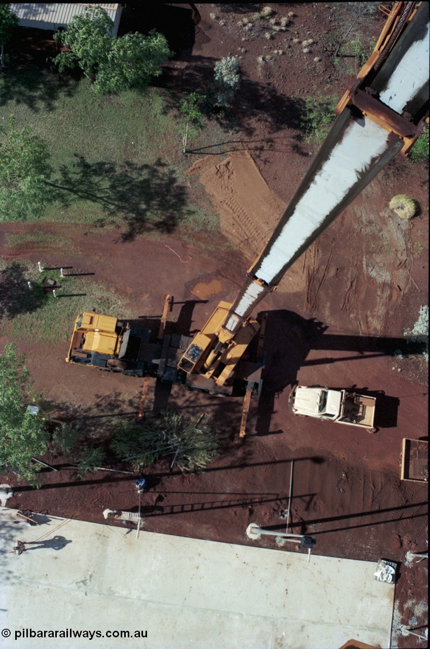 194-34
Yandi campsite for Henry Walker operated iron ore mine owned and managed by BHP, view of Kato 50 tonne hydraulic crane from man cage at full stick.
