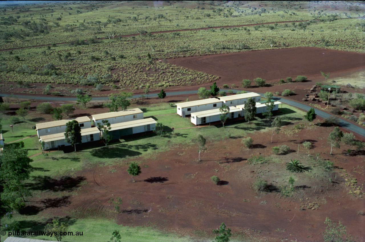 194-36
Yandi campsite for Henry Walker operated iron ore mine owned and managed by BHP, view of camp are from man cage on Kato 50 tonne hydraulic crane.
