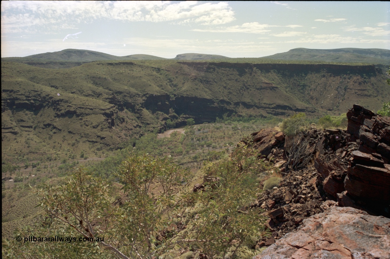 195-18
Wittenoom Gorge, view looking south down the gorge, the Colonial Mine is on the right and not visible behind the rock. The former market garden area can be just seen at the bottom left of image as Bolitho Rd cuts through the middle.
