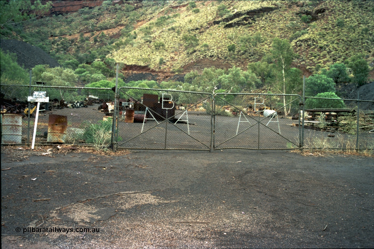 195-23
Wittenoom Gorge, Australian Blue Asbestos or ABA Colonial Mill, view of the gates on the warehouse fenced yard.
