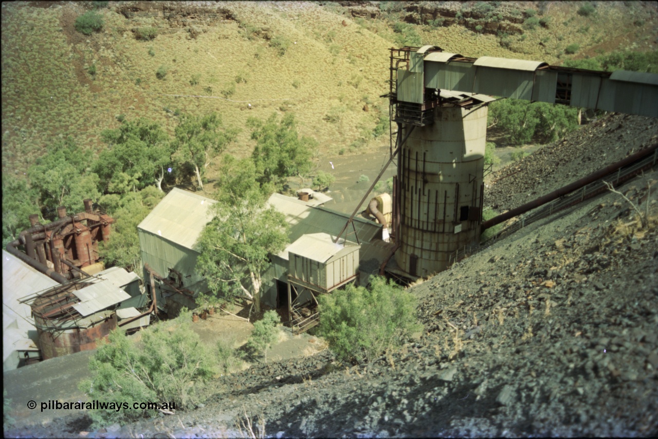 195-35
Wittenoom Gorge, Australian Blue Asbestos or ABA Colonial Mill, overview from the crusher level, looking down on the holding bin/silo and drier and milling plant.
