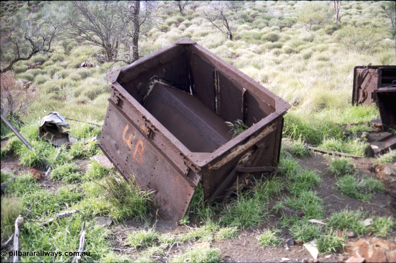 196-22
Wittenoom Gorge, Gorge Mine area, asbestos mining remains, view inside of side opening ore waggon, shows how much ore the waggons could carry.
