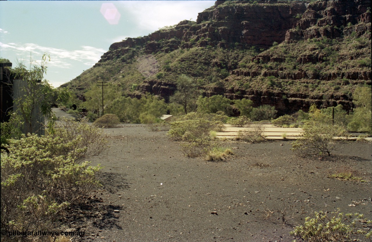 196-28
Wittenoom Gorge, Gorge Mine area, asbestos mining remains, view looking north east from remains of railways and mill towards power station, concrete pad is former workshops.
